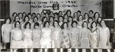 Photograph of the Treble Clef Club. Caption reads 'Women's Glee Club-1930 ~Maude Garnet -Director~ 15 cents.' Members include: Verona Wolff, Lucile Burgess, Inez Sherwood, Lutie Mae Mitchell, Thelma Melgard, Helen Stetler, Louise Morley, Ruth Johnston, Elizabeth Gilmore, Caroline Schmidt, Florence Robrer, Beryl Davis, Janet Gooding, Valetta l'Herisson, Lois Thompson, Joan Harris, Gladys Gleason, Jean Edmiston, Lois Hall, Mary Baird, Pauline Paterka, Audrey Anderson, Ellen Chandler, Laura Clark, Agnes McKeirnan, Beth Wood, Betty Lambdin, Marion Lewis, Vivian Edmiston, Lucile Viste, Caryl Thompson, Elinor Jacobs, Virginia Knee, Ruth Ramstedt, Edna Richards, Linn Cowgill, Geneva Snook, and Agnes Ramstedt.