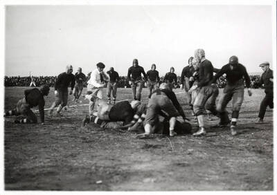 Photograph of the University of Idaho versus Utah football game. Score: Idaho-10, Utah-0.