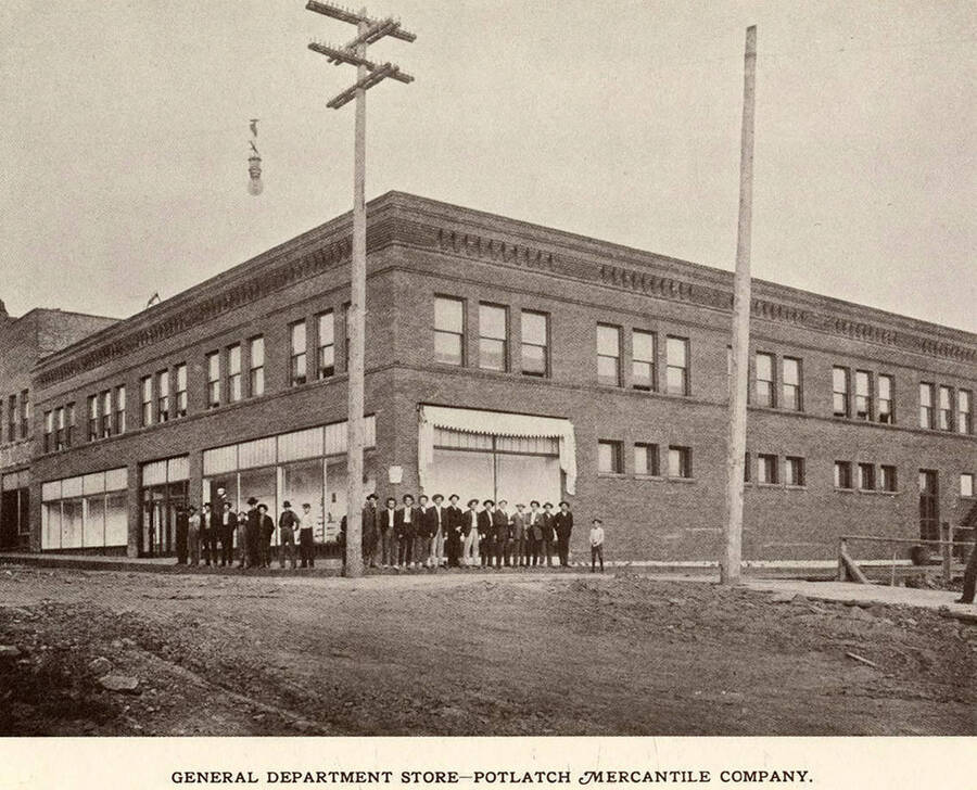 A photograph of people outside the Potlatch Mercantile Company which was the general department store for the town.