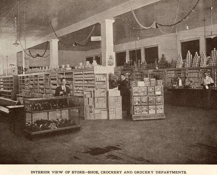 The interior view of the shoe, crockery, and grocery departments at the Potlatch Mercantile Company.