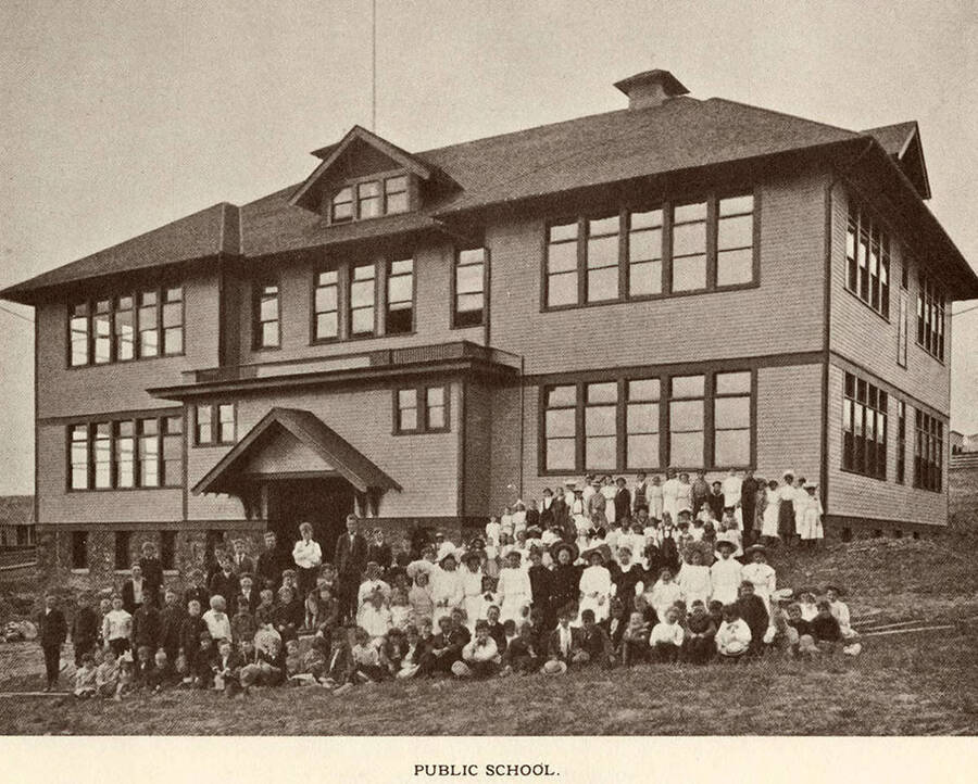 A group of children outside the public school at Potlatch.