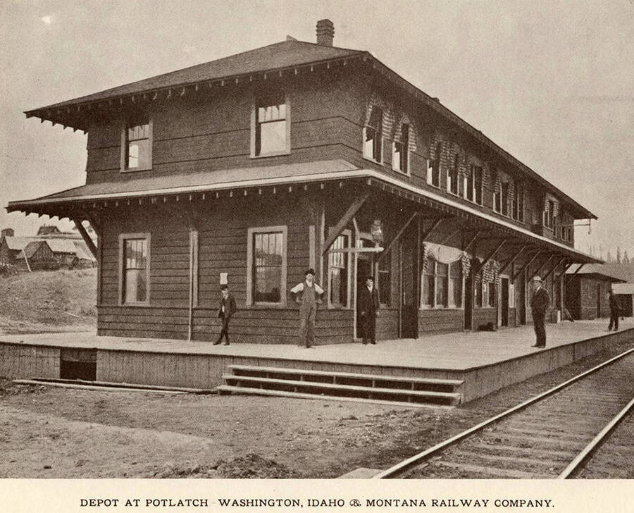 A photograph of the train depot at Potlatch for the Washington, Idaho, and Montana Railway Company.