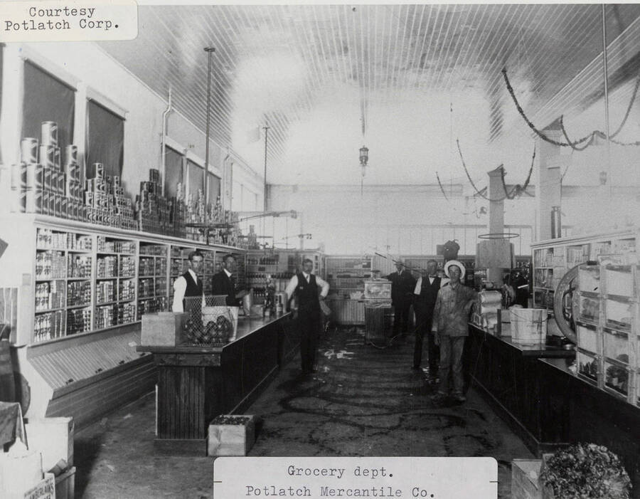 A photograph of the grocery department in the Potlatch Mercantile Company.