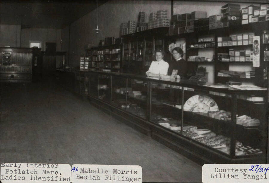 A photograph of Mabelle Morris and Beulah Fillinger in the early interior of Potlatch Mercantile Company.
