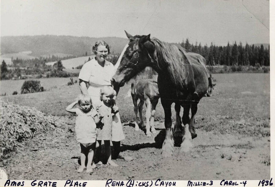 Photograph of Rena (Hicks) Cayou with Millie [age 3] and Carol [age 4] at the Amos Grate place.