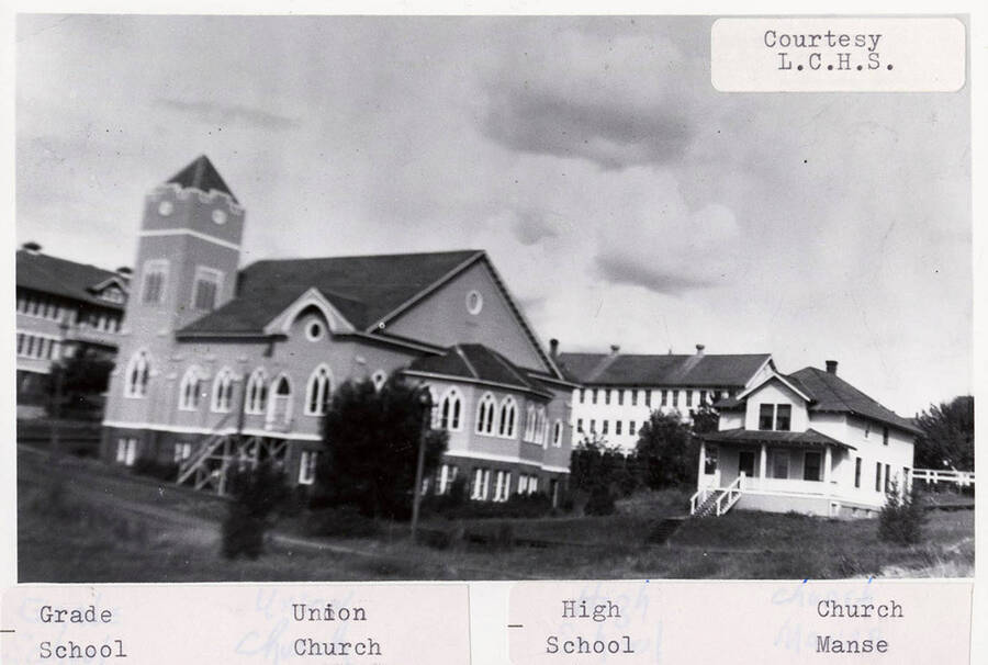 A photograph of the grade school, union church, high school, and church manse in Potlatch Washington.