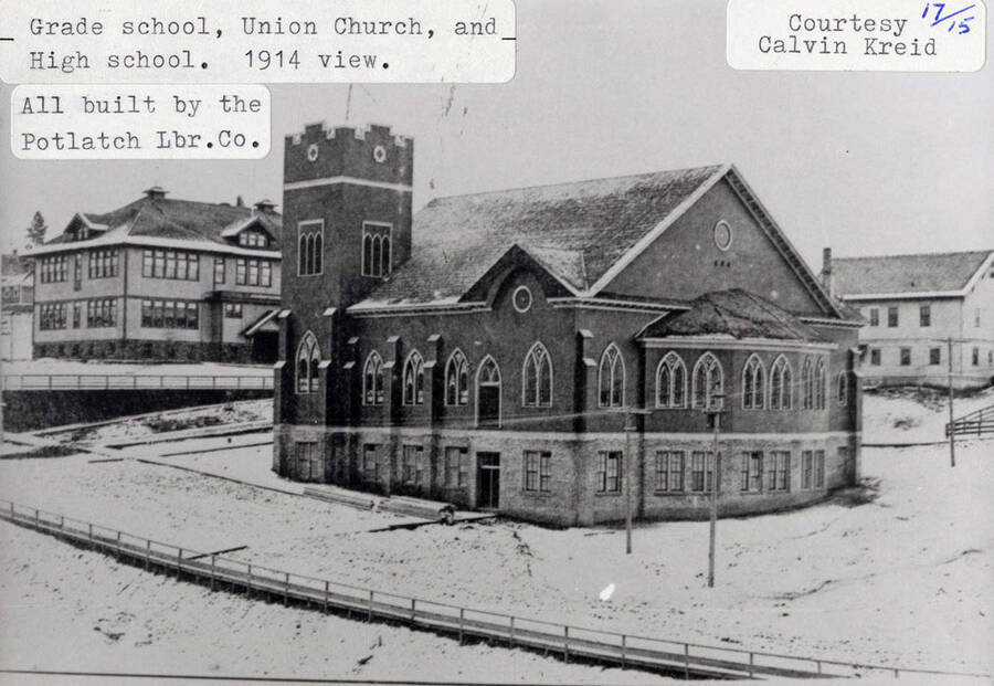 A photograph of a 1914 view of the grade school, Union church, and high school that were all built by the Potlatch Lumber Company. Photo courtesy of Calvin Kreid