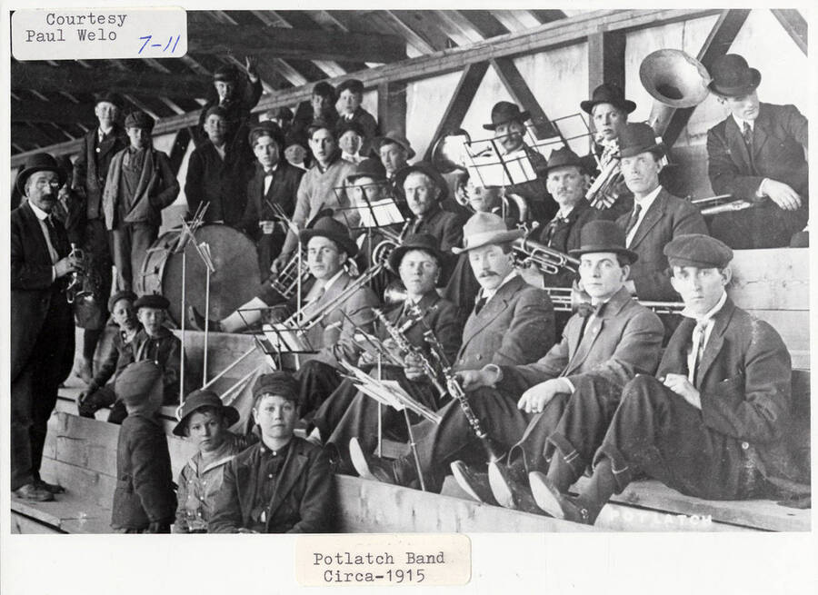 A photograph of the Potlatch Band with their instruments.