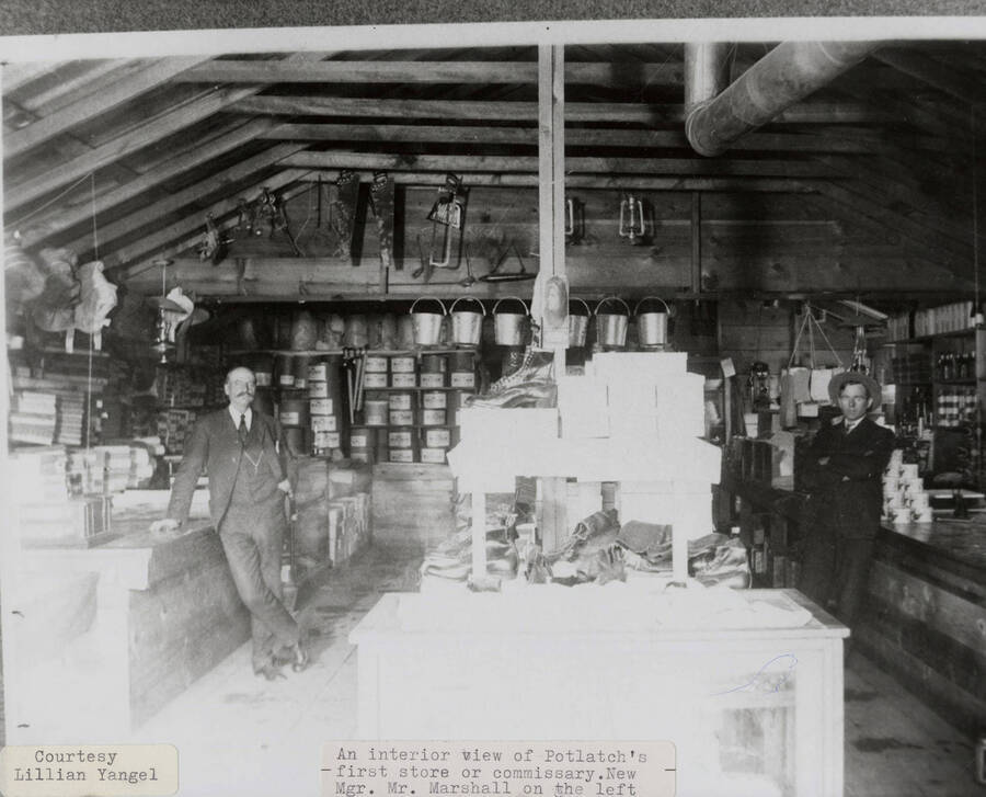 A photograph of manager Mr. Marshall (left) inside the first store or commissary in Potlatch.