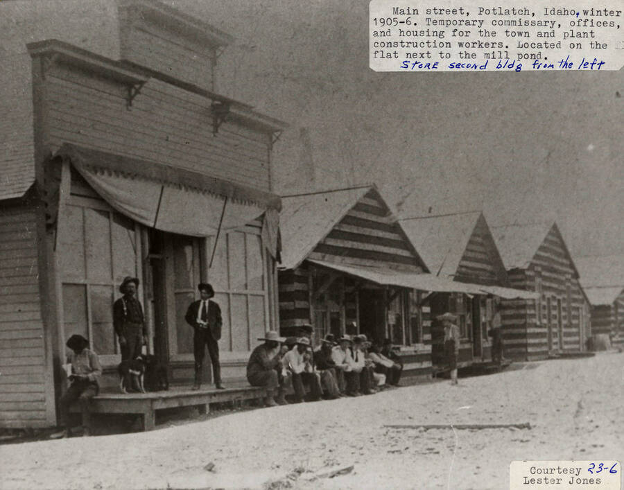 A photograph of the temporary commissary, offices, store (second building from left), and housing on Main St. in Potlatch, Idaho. Located on the flat next to the mill pond during the winter of 1905-1906.