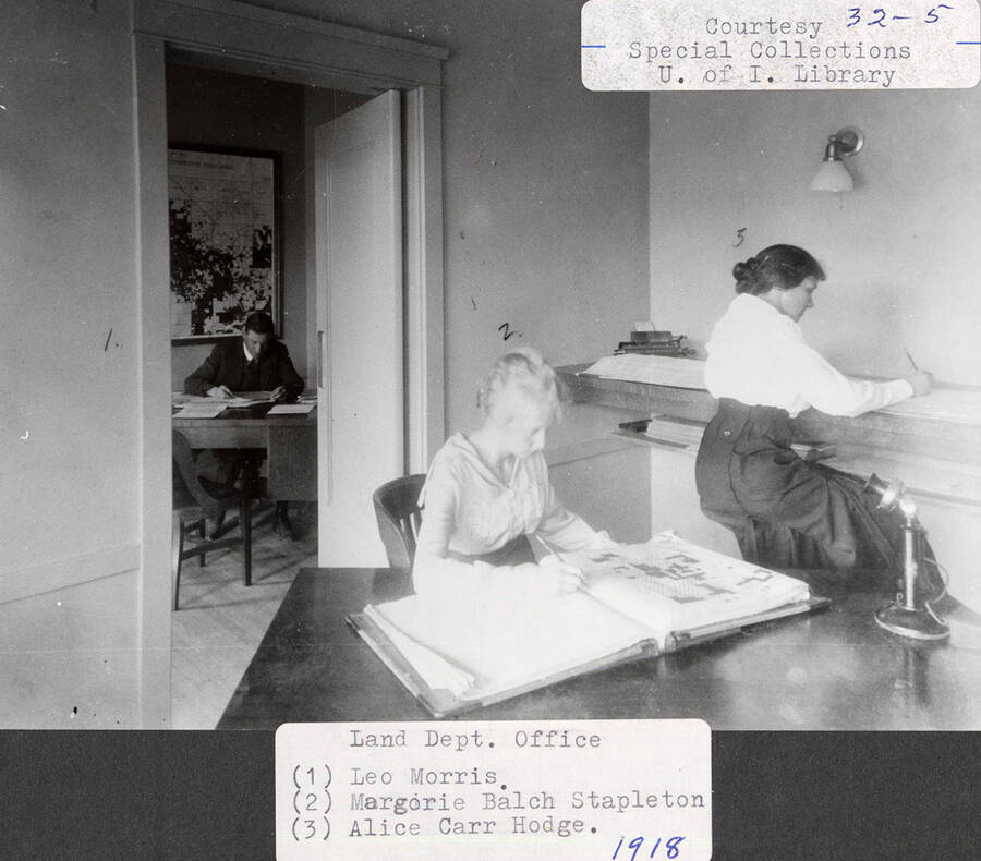 A photograph of the Land Dept. Office with Leo Morris, Margorie Balch Stapleton, and Alice Carr Hodge.