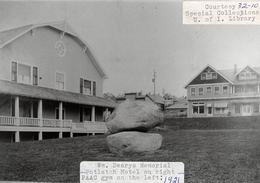 A photograph of Wm. Deary's memorial with the Potlatch Hotel on the right and PAAC gym on the left.