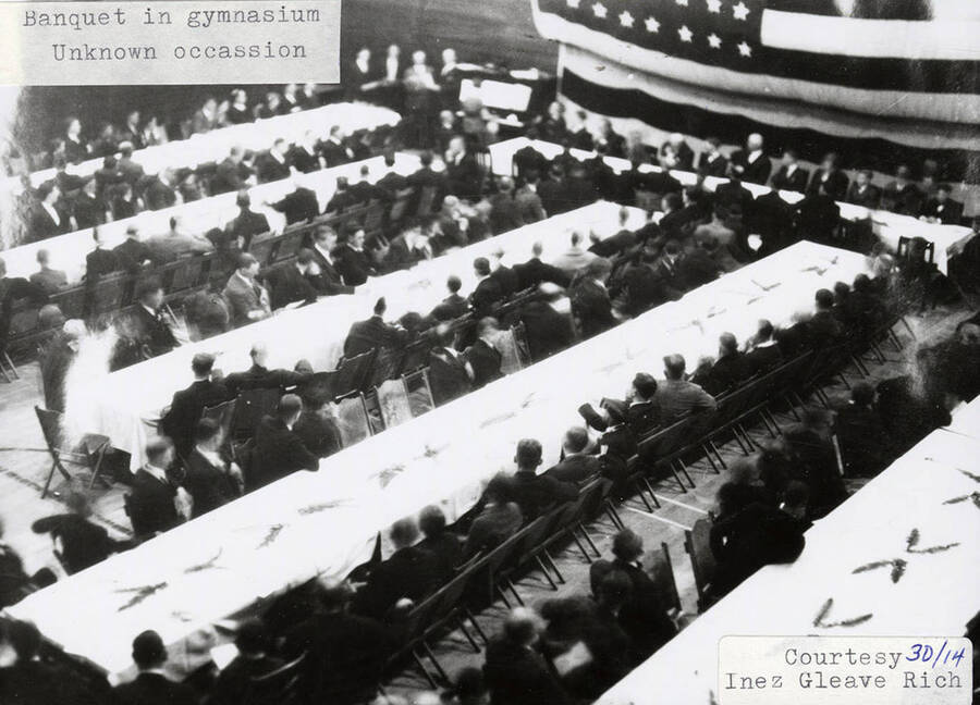 A photograph of a banquet in the gymnasium for an unknown occasion.