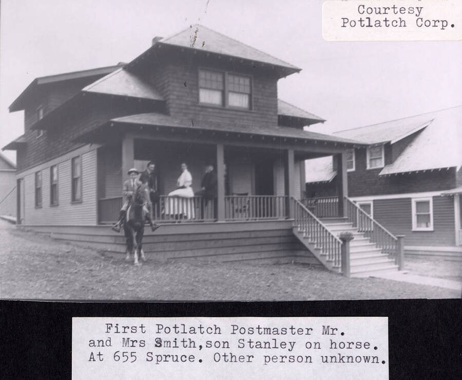 A photograph of the first Potlatch Postmaster Mr. and Mrs. Smith, son Stanley on horse. At 655 Spruce. Other person unknown.