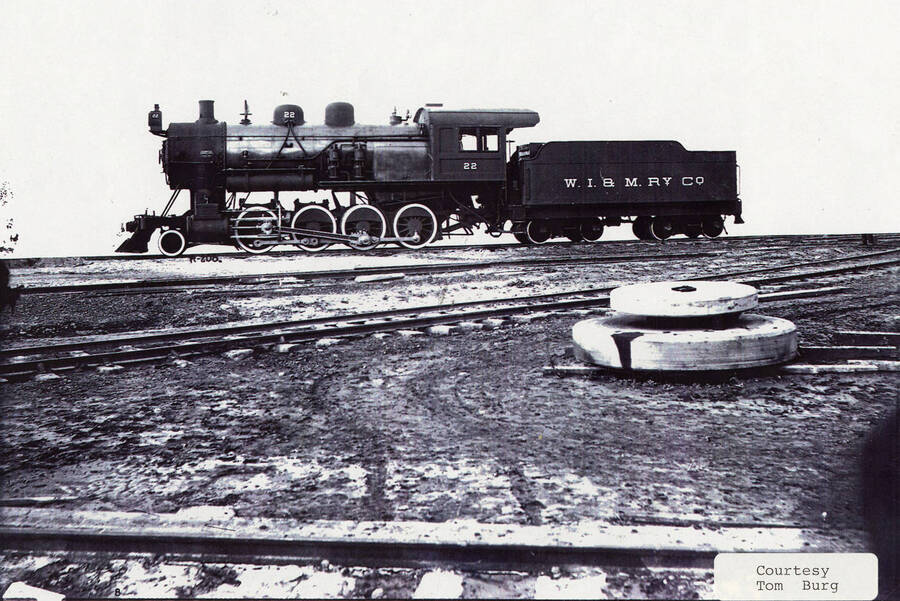 View of a No. 22 locomotive. The locomotive can be seen sitting in the middle of a group of railroad tracks.