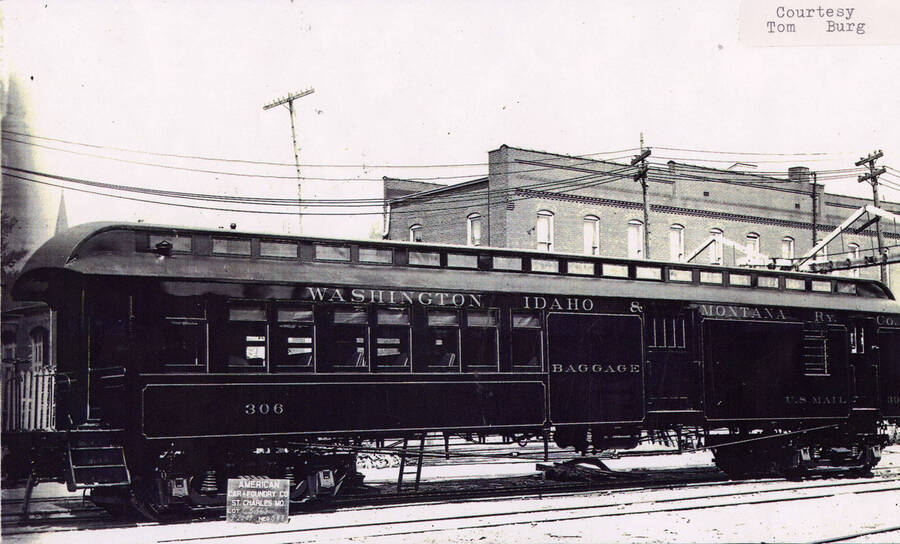 View of a WI&M railroad car made by the American Car Foundry Company. The car says 'Baggage' and 'U.S. Mail' on the side.
