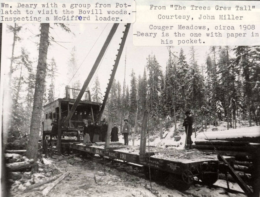 A group from Potlatch visiting the Bovill woods to inspect a McGifferd loader. William Deary was among the group; he can be seen standing on a flat car with some paper in his pocket.