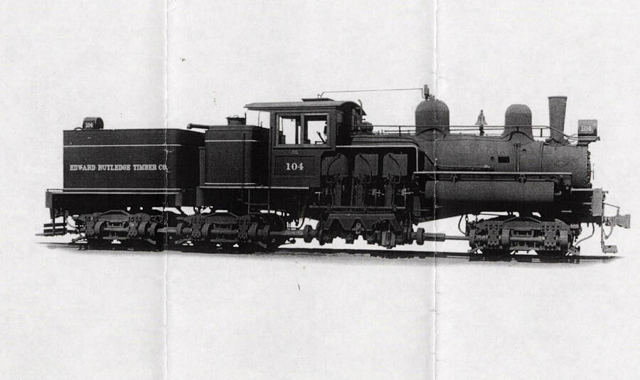 View of a locomotive, which says 'Edward Rutledge Timber Co.' on the side.