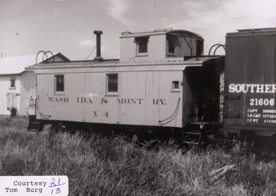 View of a WI&M railroad car. The car can be seen connected to another railroad car.