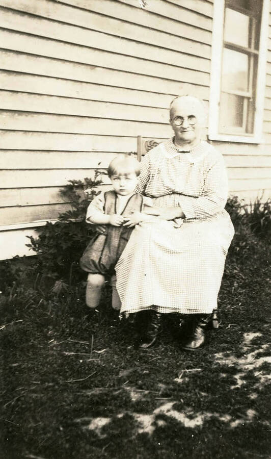 A portrait of Grandma Bysegger and grandson Max Davis at Darrell and Mary Nirks place.