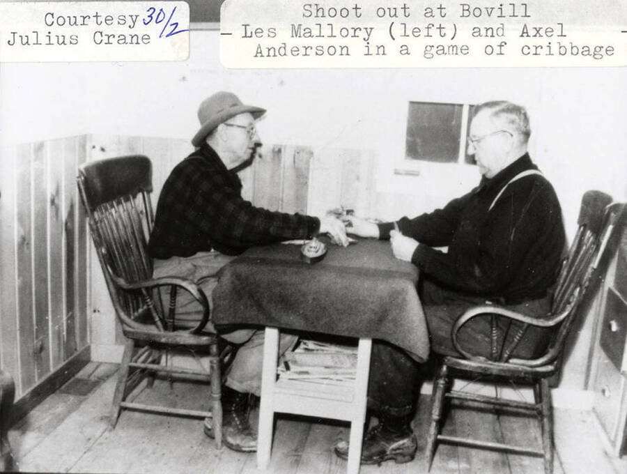 Les Mallory (left) and Axel Anderson (right) playing a game of cribbage together.