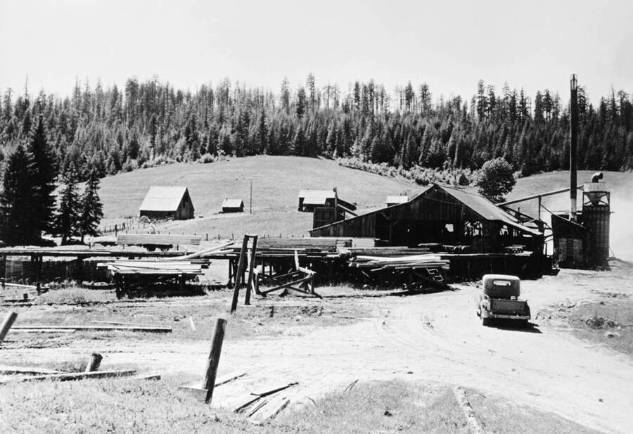 D.I. Nirk Lumber Company. The old barn is on the left, and the house is in the center behind the mill.