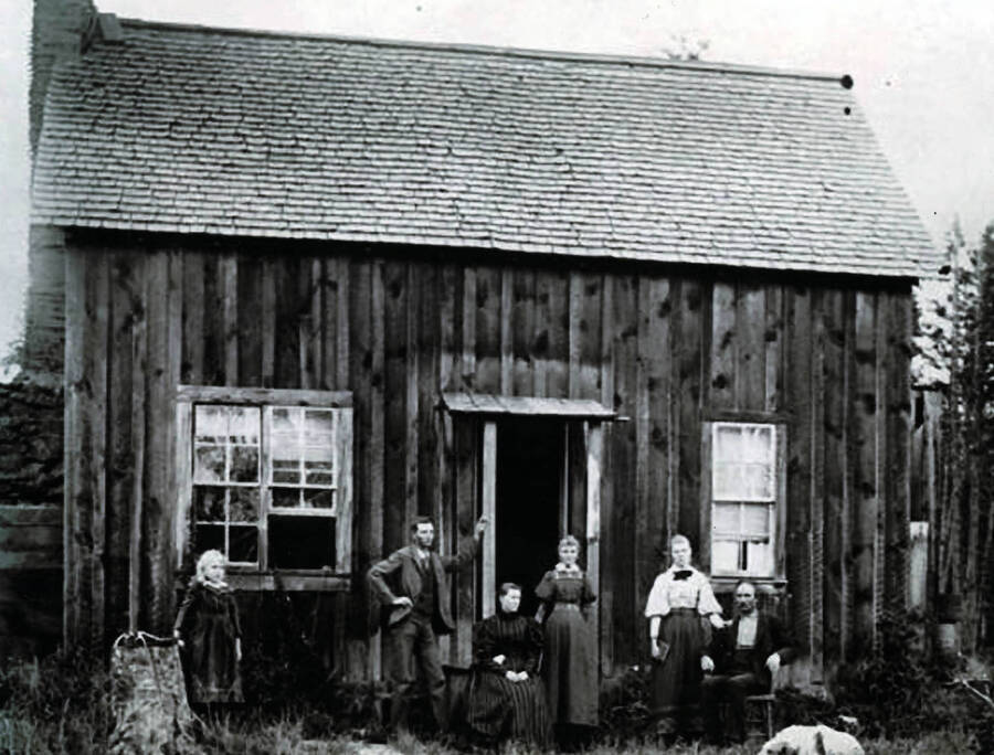 J.R. Strong and home on Deep Creek, northwest of Potlatch. Names read as subjects appear, left to right: McElroy, Alice; Alva; Mrs. J.R. Strong; Eaa Estes; Eunice Moak; J. R. Strong