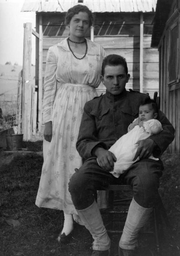 Mary Bysegger Nirk, standing, and Durell Nirk holding daughter Cleora Anna Nirk