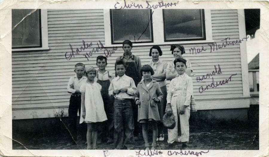 Schoolchildren in front of Burden School. (Left to right) back row Charles Davis, Harold Davis, Elvin Swatman, Mrs. Crowe, Mae Martinson, front row Patsy McManama, Bob Davis, Lillian Anderson, Arnold Anderson