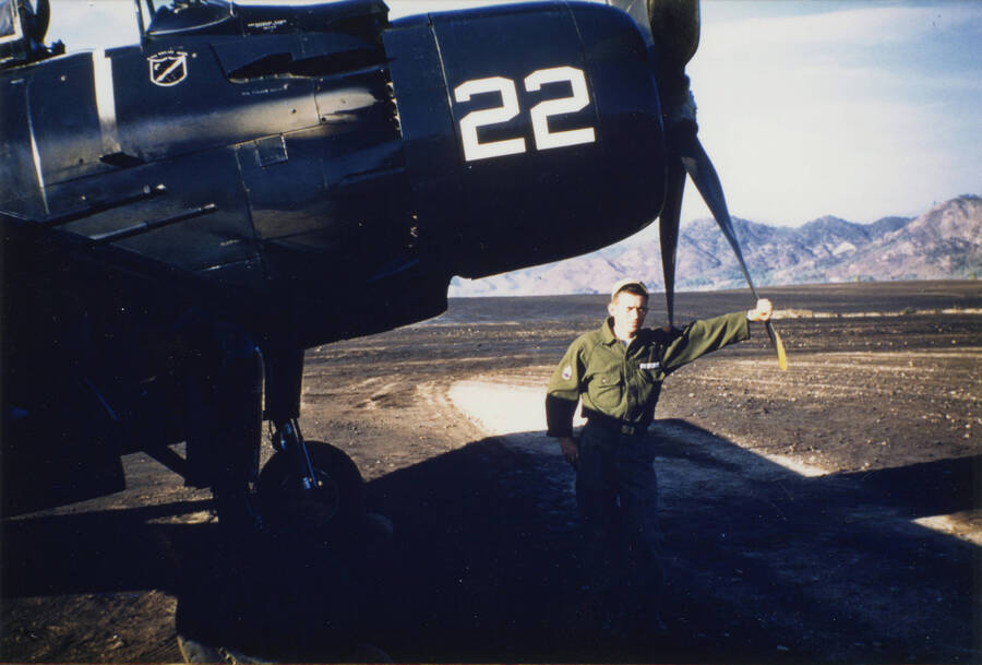 Norman Soncarty standing near Plane 22 in Korea