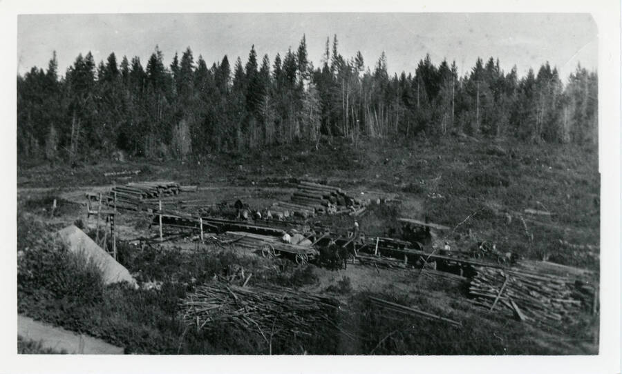 Photo of Durell Nirk's first sawmill east of the barn on the home place