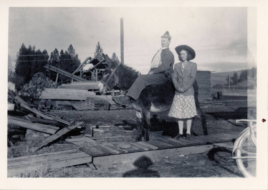 Clara (Bysegger) and Henry Brandt pose for a photograph. Henry sits atop a donkey.