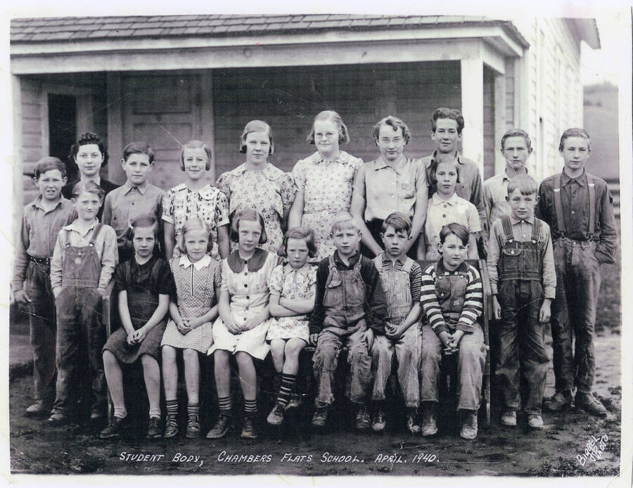 A 1940 class photo of the students at Chambers Flat School. Some student names are included but which name goes with which student is not identified: Lawrence Long, Willette West, Mae Carstens, Patricia Olfs, Helen Schott, Lyle Long, Alvin Wilson, Ernie Wilson, Charles Cochrane, Ruth Carstens, Pearl Krough, and Joyce Krough. 