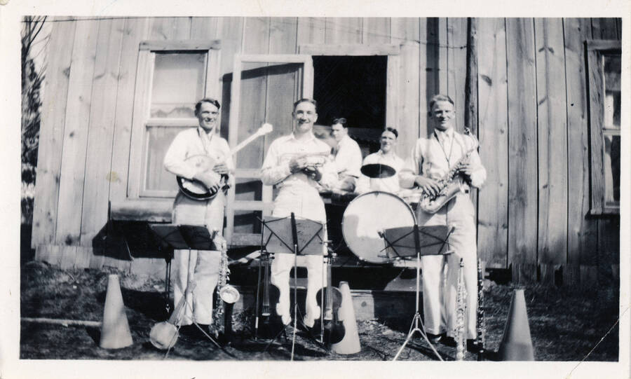 The Bye Brothers Band poses for a portrait with their instruments. Band members include Stubb Bye, Paul Bye, Ed Maines, Francis Bye, and Vernon Bye.