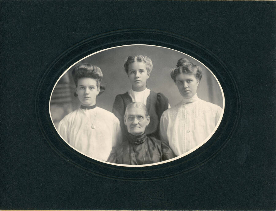 Portrait photograph of Amanda McClure and her daughters (left to right): Flora, Alice and Ruth.