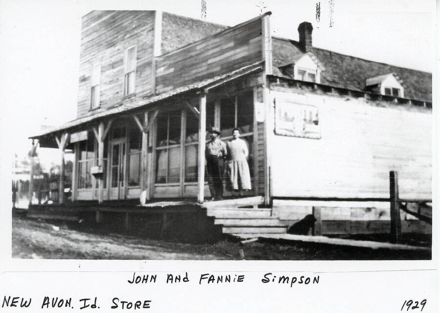 John and Fannie Simpson stand on the porch of the store in New Avon, Idaho.