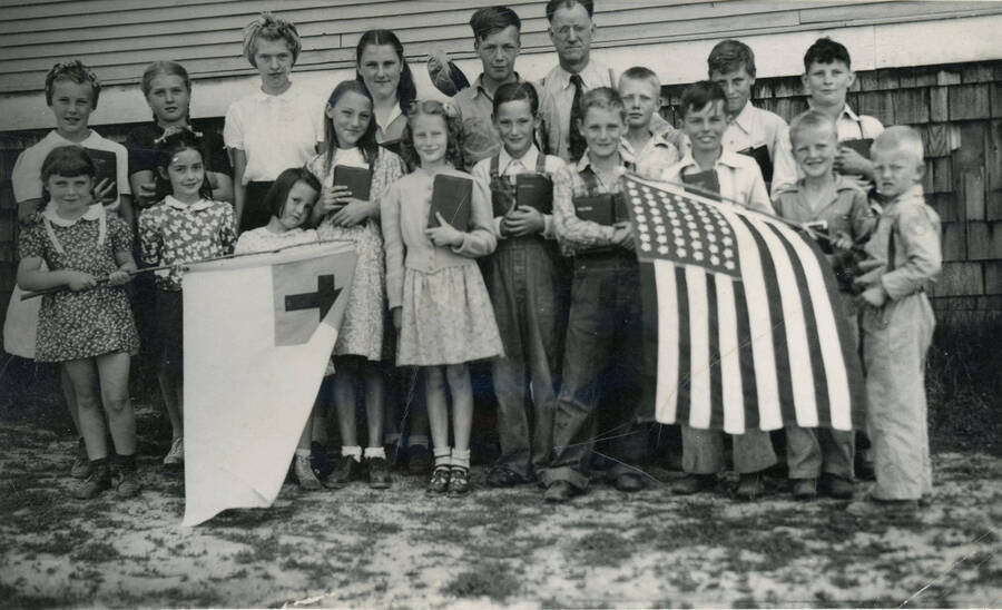 Rock Creek Bible School ca. 1943. First Row: Diana Clossen, Merry Rose Richardson, Lyndell Fitch, Celia Fitch, Violet Krasselt, Luther Fitch, David Youmans, Bobby Crenshaw, Bobby Hansen, Floyd Hansen. Second Row: Violet King, Norma Beckemier, Patsy McManama, Betty Fitch, Harry Button, Mr. Johnson, teacher, unidentified, Elden Fitch, Bobby Bell.