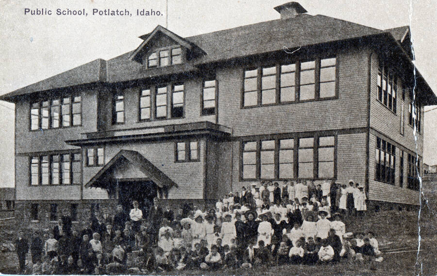 A class photo taken in front of the Potlatch School.