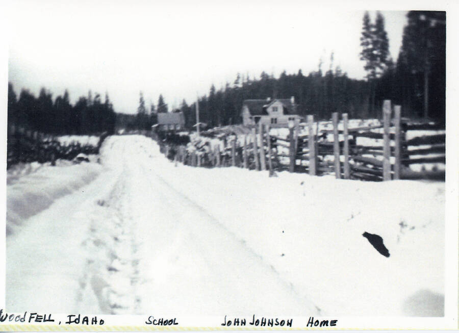 Looking down a snow covered road towards the John Johnson home in Woodfell, Idaho.