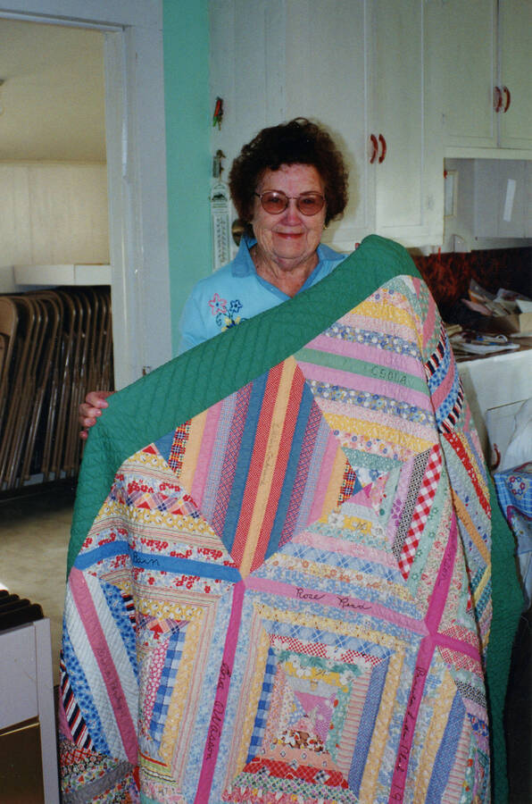 Norma Cowger with a1937 quilt.