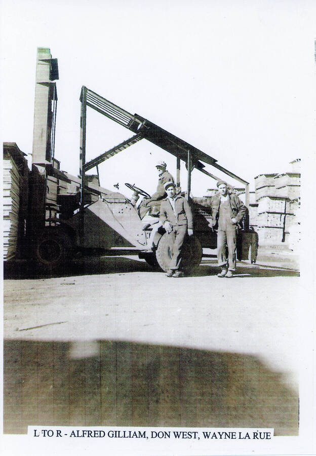 Three men operate a lift truck at the Potlatch mill. From left to right: Alfred Gilliam, Don West, and Wayne LaRue.