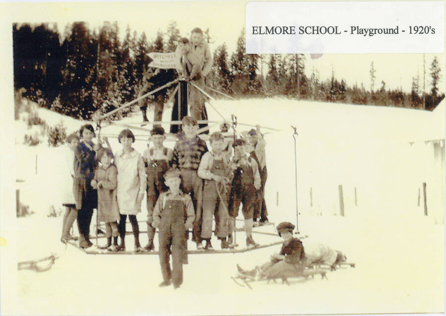 Children pose for a photo on the Elmore School playground.
