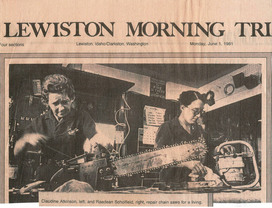 A front page news clipping from the Lewiston Morning Tribune that shows Claudine Atkinson and Raedean Scholfield fixing chainsaws.