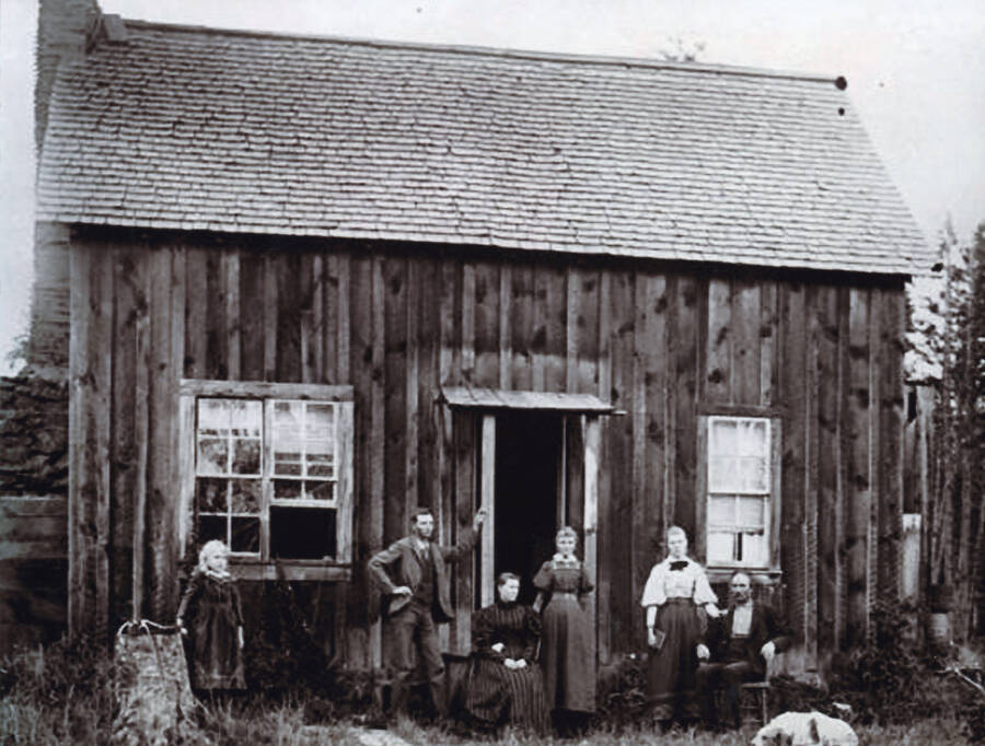 J.R. Strong Family and home on Deep Creek northwest of Potlatch. Left to right: Alice, Alva, Mrs. J.R. Strong, Etta, Eunice and J.R. Strong. Photo taken in April 1891.