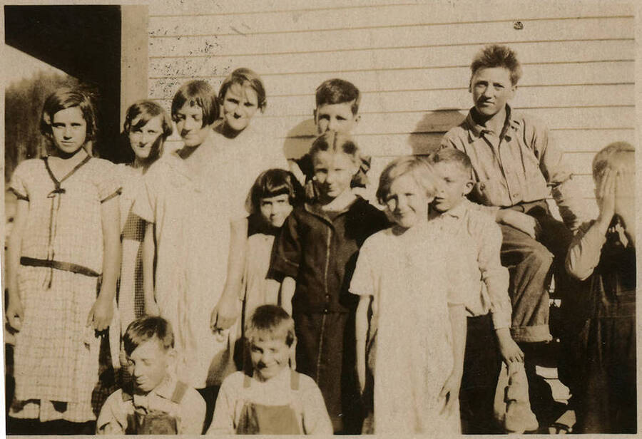 Students in front of the Elmore School probably in the mid to late 1920s. Back Row: Mary Krasselt, Louella Hall, Leslie Swatman, Barton Wetzel. Second Row: Cleora Nirk, Xythel Hall, Louise Katzenberger, Marie A?, Vic Beplate, Homer Krasselt. Front Row: Homer Katzenberger and Wallace Krasselt.