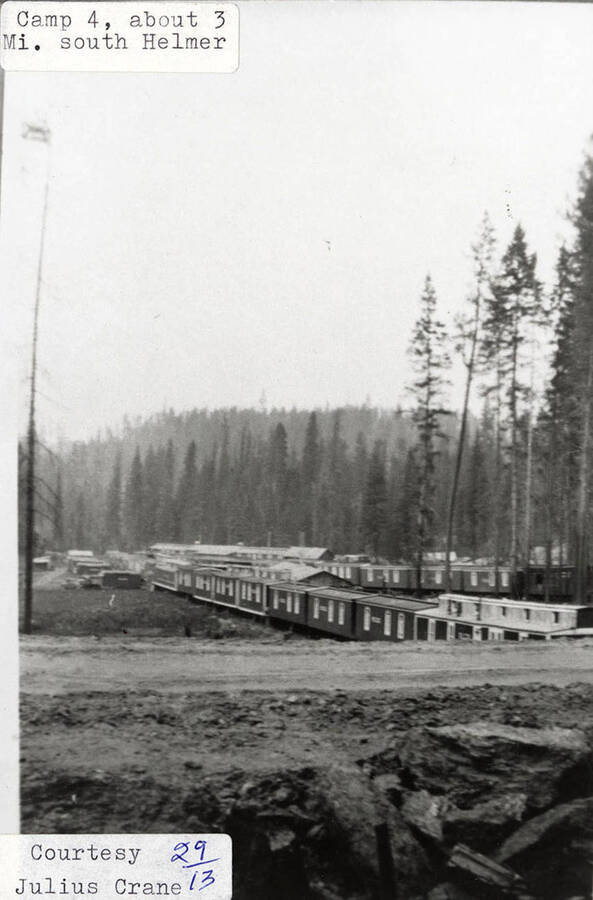 View of PLC Camp 4, which is located 3 miles south of Helmer, ID. A row of buildings can be seen on the camp.