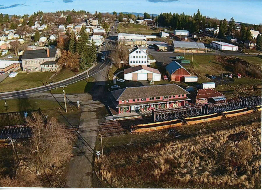 Photograph of the WI&M Depot with the city of Potlatch in the background.