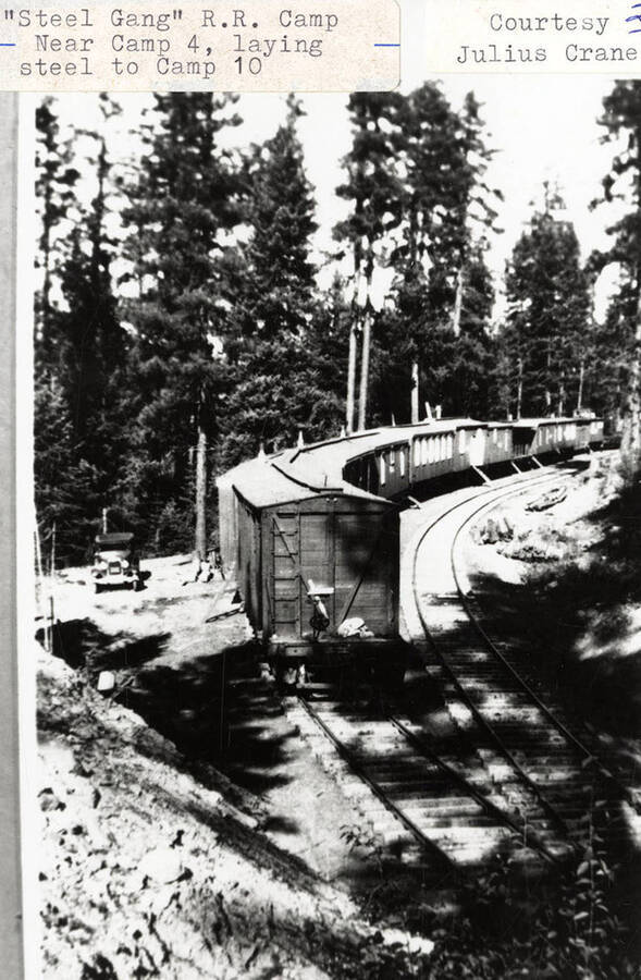 View of the 'Steel Gang' railroad camp, which is located near Camp 4. A train can be seen on the railroad tracks.