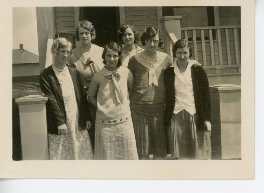 Photograph of a group of teachers on the steps in front of the teacher's dormitory. Esther Johnson, Terma Thompson, Mary Wright, Helen McDowell, Faye Magers Sanders, Josephine Thomas (Alexander).