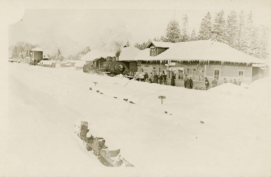 Postcard of unidentified train depot in winter.